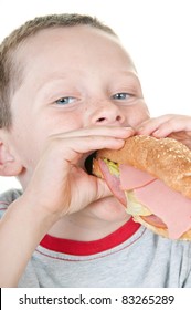 Boy Eating Huge Sandwich