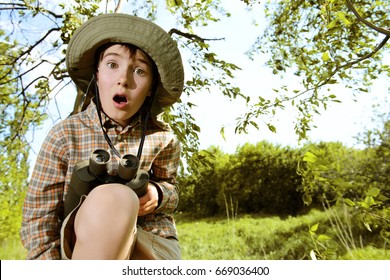 Boy exploring nature and the world around us. Adventure trips. The young scout. - Powered by Shutterstock