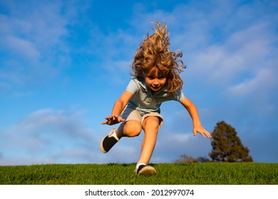 Boy Falling Down On Grass. Kid Falling Off At The Park. Child Insurance And Childcare.