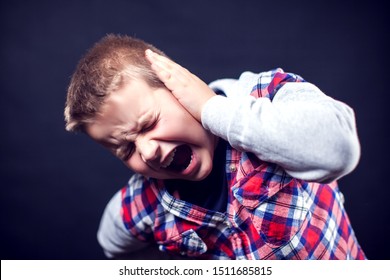 A Boy Feels Strong Ear Pain. Children, Healthcare And Medicine Concept