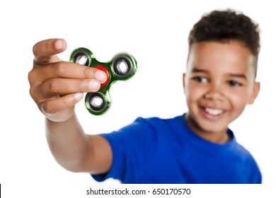 A Boy Fidget Spinner Held in Foreground