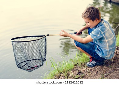 Boy Fishing With A Net