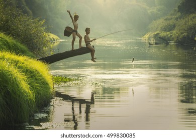 Boy Fishing At The River