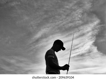 Boy With Fishing Rod In Black And White,