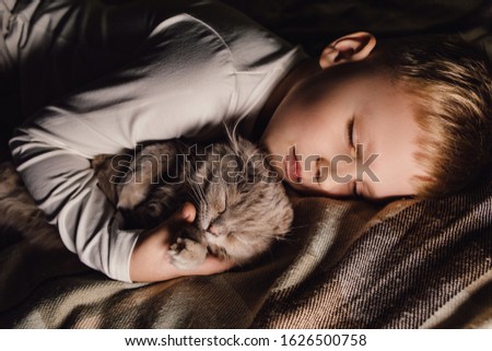 Similar – Newborn baby with pompom hat sleeping on blanket