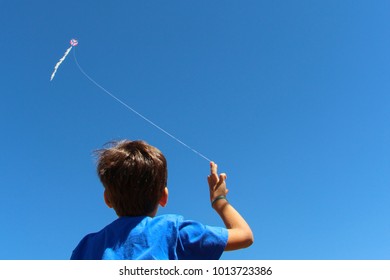 Boy Flying Kite - Shutterstock ID 1013723386