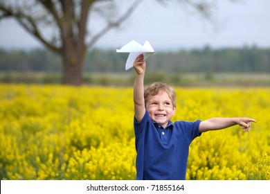 Boy Flying A Paper Airplane