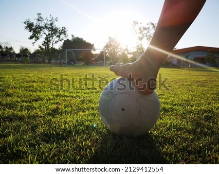 the boy foot on ball for healthy exercise activity on ground