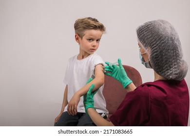 Boy Getting Flu Shot. Cropped Nurse Giving Child Intramuscular A