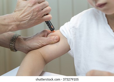 Boy Getting Insulin After Measuring Glucose Or Blood Suger Level