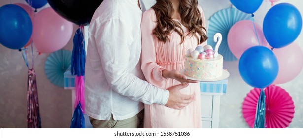 "Boy or girl" cake and different treats for gender reveal party - Shutterstock ID 1558751036