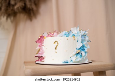 "Boy or girl" cake and different treats for gender reveal party