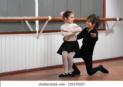 Boy And Girl Dancing In A Ballet Barre