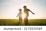 boy girl and dog a running in the park. happy family kid dream holiday concept. children hold hands brother sister run across the field silhouette summer in the park. kids run sun