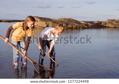 Similar – Boy at the lake