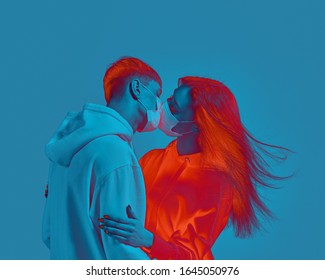 Boy and girl kiss. Medical protective mask on face. Fear of virus infection. Modern poster design with copy space.