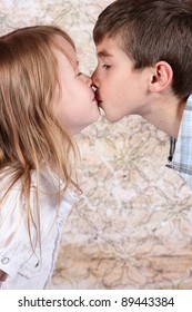 boy and girl kissing each other - closeup