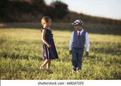 boy and girl looking at each other in the sunset light