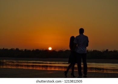boy and girl meet sunset by the river - Shutterstock ID 1213812505