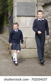 Boy And Girl On A Front Of School On First School Day After Summer Holidays (dance)