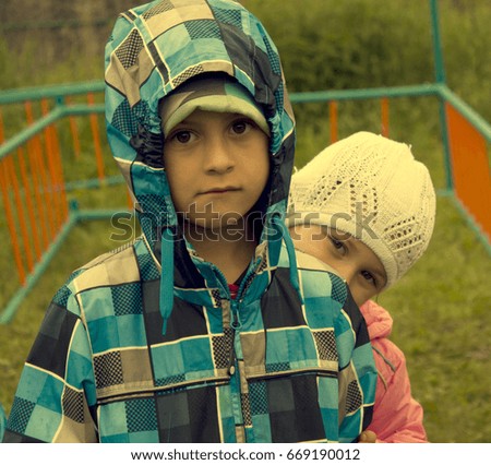 Similar – Mother with her seven year old daughter laughing in a cabin in the countryside