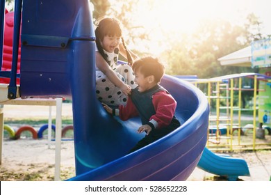 boy and girl on the playground - Shutterstock ID 528652228