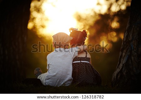 boy and girl on sunset