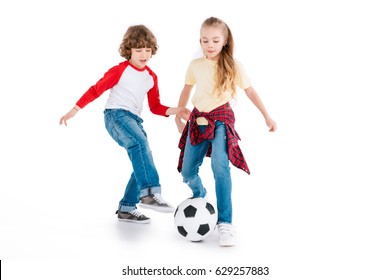 Boy and girl playing football isolated on white, children sport concept
