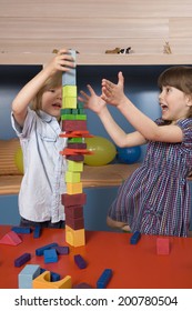 Boy Girl Playing With Wooden Building Blocks Boy Building Tower Girl Afraid That Tower Falling