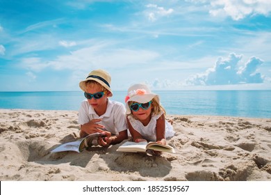 Boy And Girl Read Books On Beach, Family Vacation