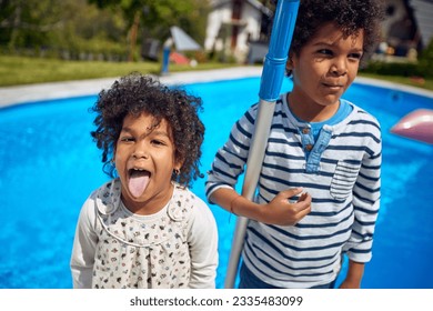  boy and girl take center stage, radiating happiness. The girl, with a mischievous grin, playfully sticks out her tongue, adding a touch of spontaneity to the moment.  - Powered by Shutterstock