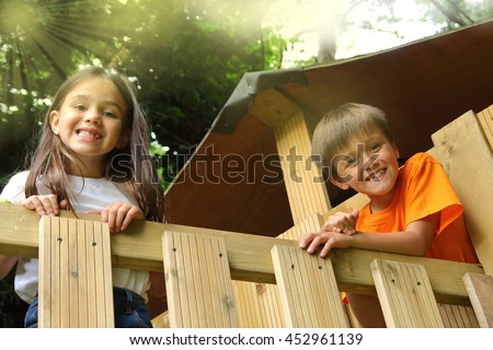 Boy and girl in a treehouse