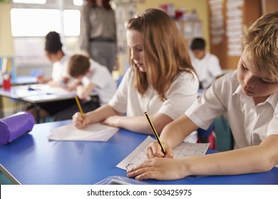 Boy And Girl Working In Primary School Class, Close Up