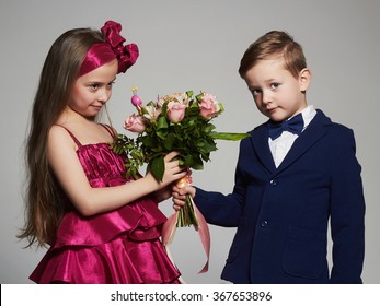 Boy Gives A Girl Flowers.little Beautiful Couple.kids Love,valentine.roses Bouquet