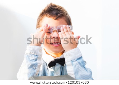 Similar – Child with reading magnifier