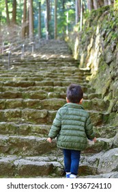 Boy going up the stone steps