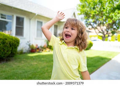 Boy With Good Bye Or Hello Sign Outdoor. Kids With Funny Face Bye Bye Hand On Backyard. Emotional Child.