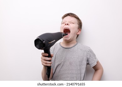 Boy With Hair Dryer Close Up