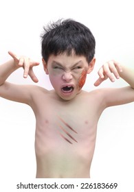 Boy With Halloween Zombie Make Up Over White Background