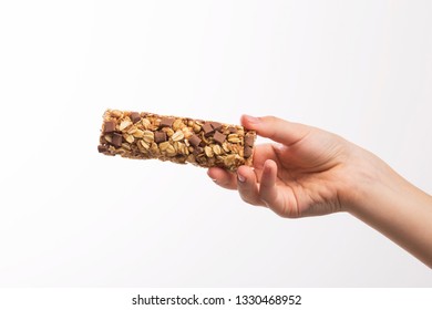 Boy Hand Holding A Cereal Bar With Big Chunks Of Chocolate