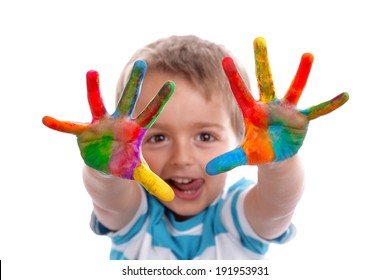 Boy with hands painted in colorful paints ready to make hand prints - Powered by Shutterstock