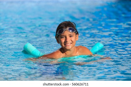 Boy Happy Swimming In A Pool 