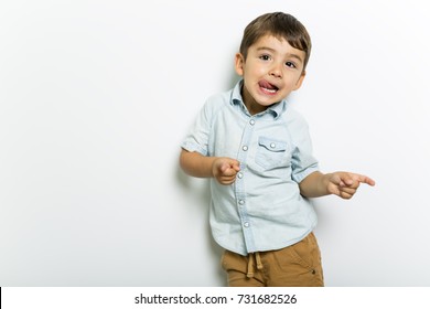 A Boy having fun on studio grey background
