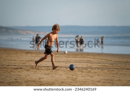 Similar – Image, Stock Photo Three generations female playing soccer on the beach