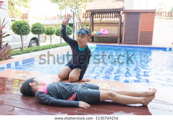 Boy Helping Drowning Child Girl Swimming Stock Photo 1130764256 ...