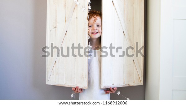 Boy Hid Closet Looks Out Closet Stock Photo Edit Now 1168912006