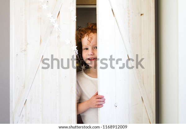 Boy Hid Closet Looks Out Closet Stock Photo Edit Now 1168912009