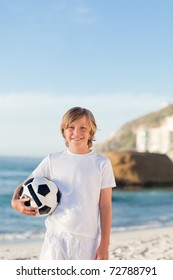 Boy With His Ball On The Beach