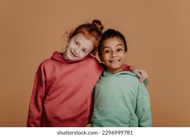 Boy with his friend posing during studio shoot. - Powered by Shutterstock