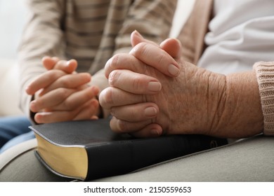 Boy And His Godparent Praying Together, Closeup